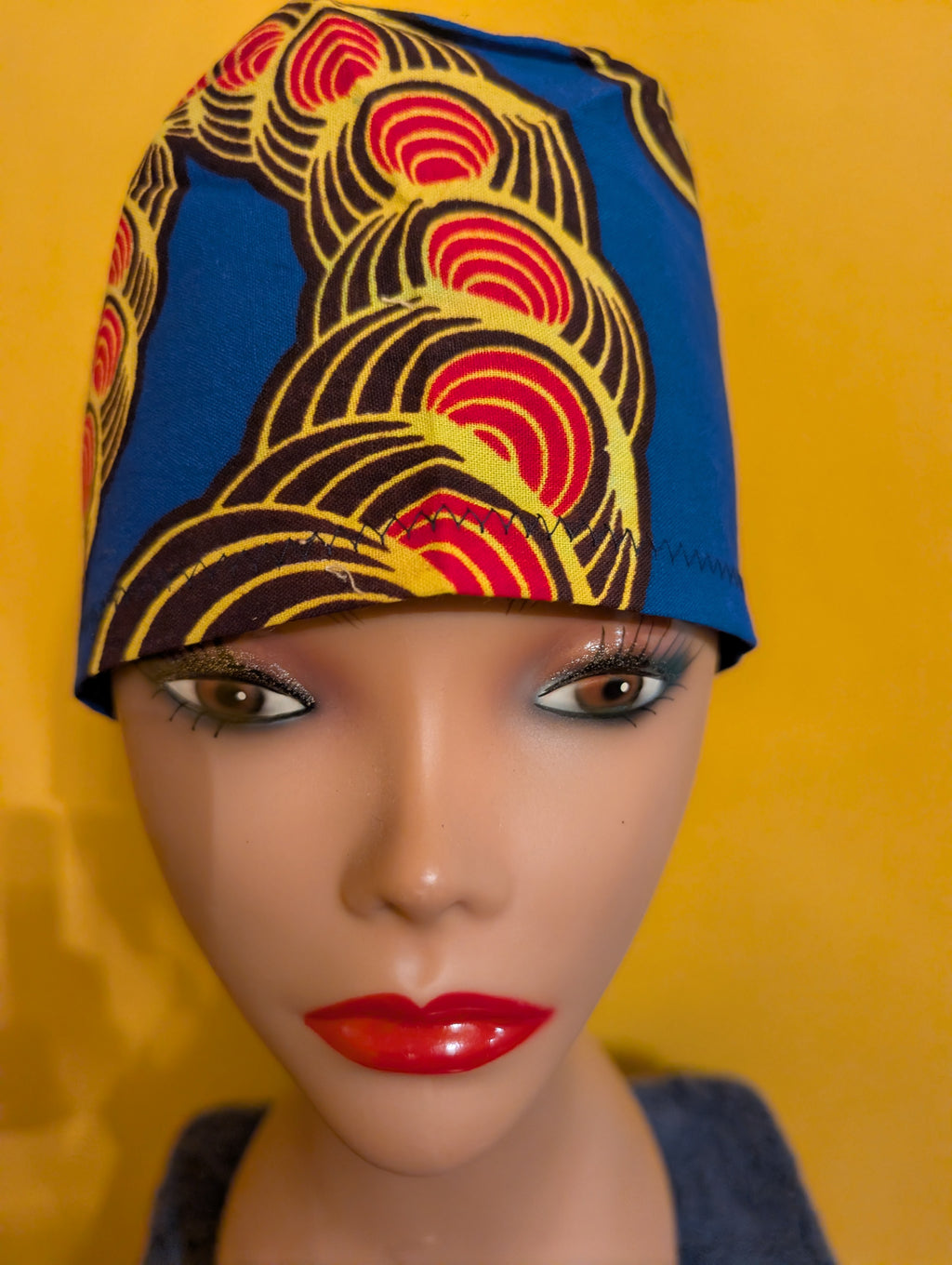 Blue/Yellow/Red/Black Tie in the back hat