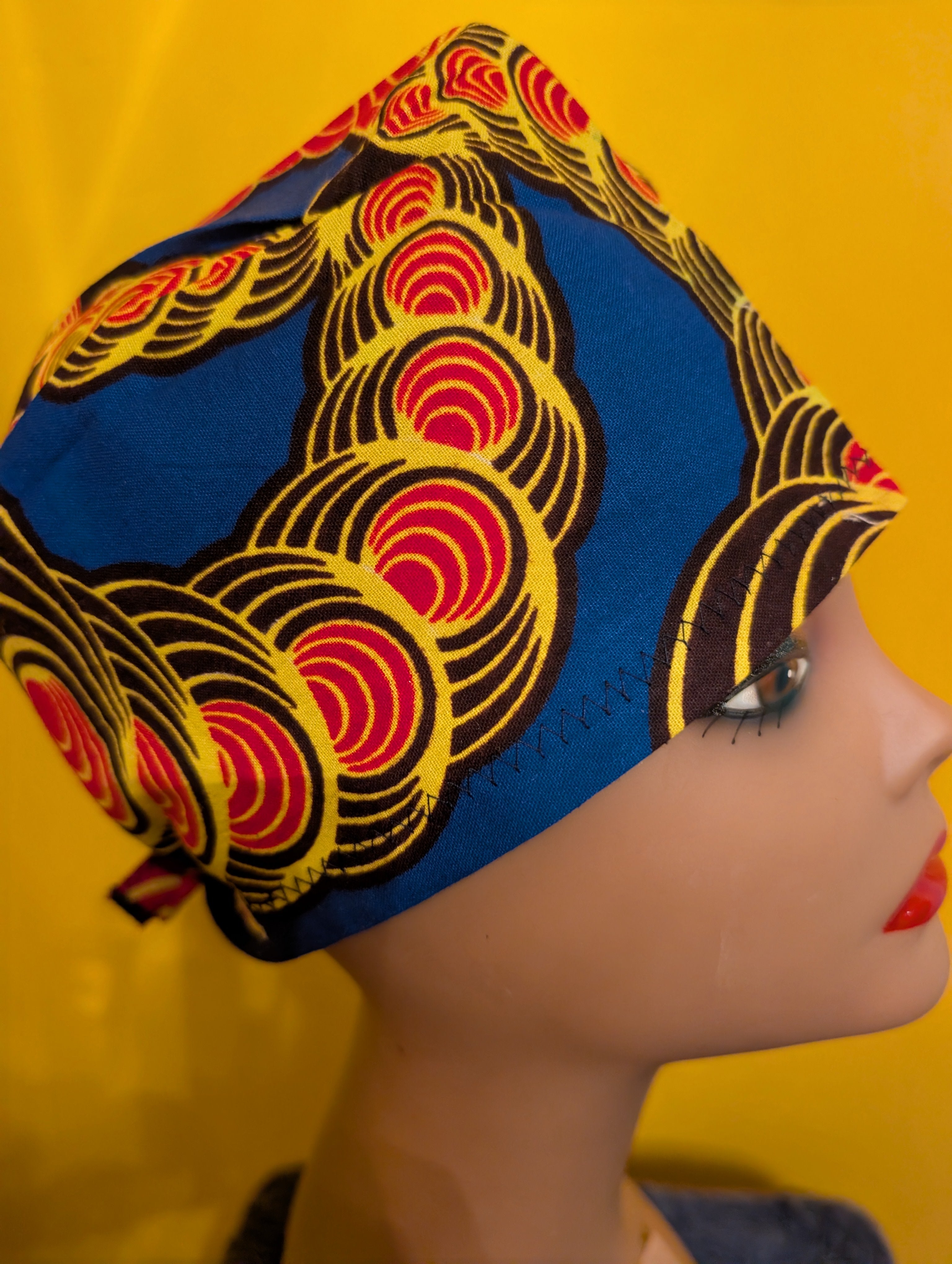 Blue/Yellow/Red/Black Tie in the back hat